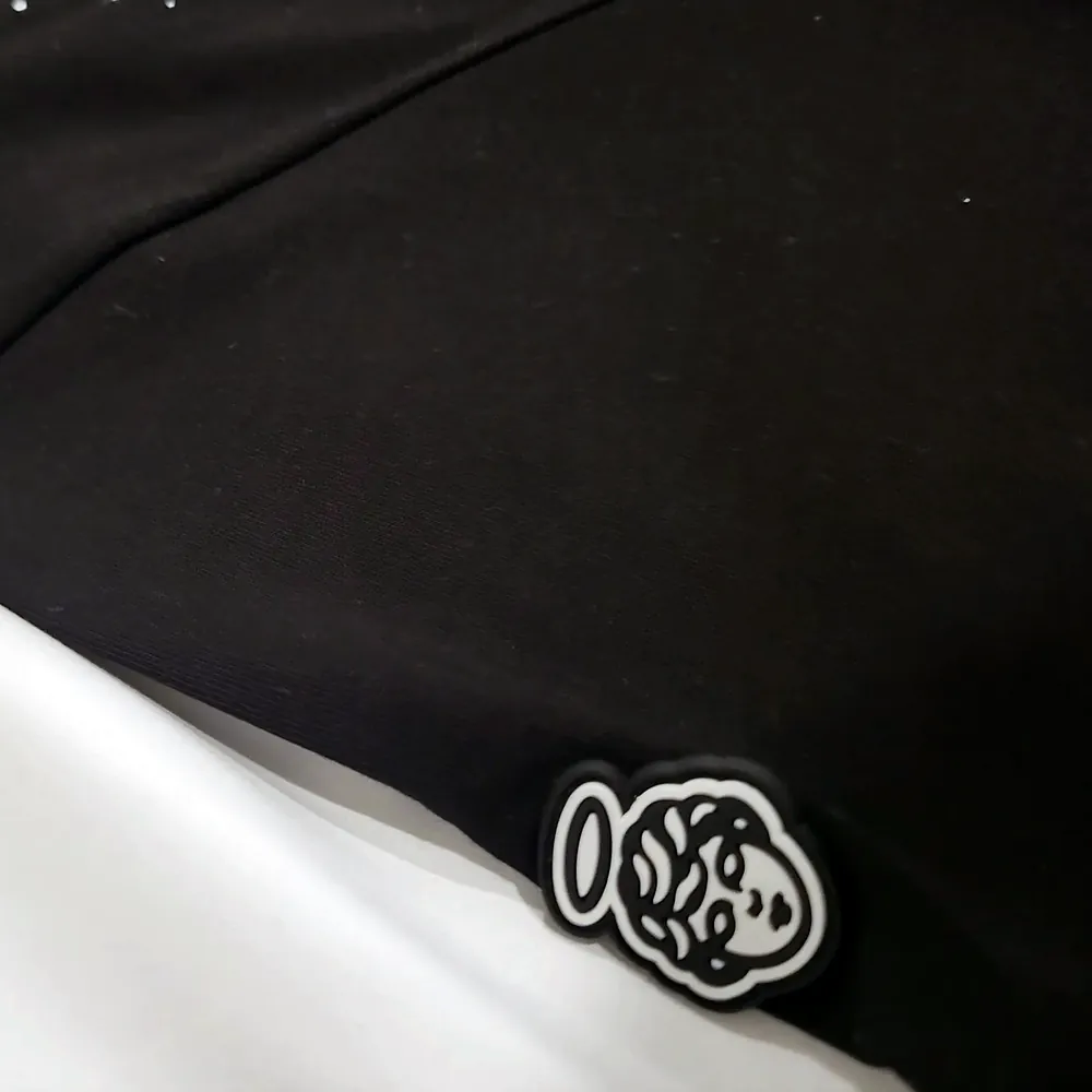 Photo of the haloed angel patch on the sleeve